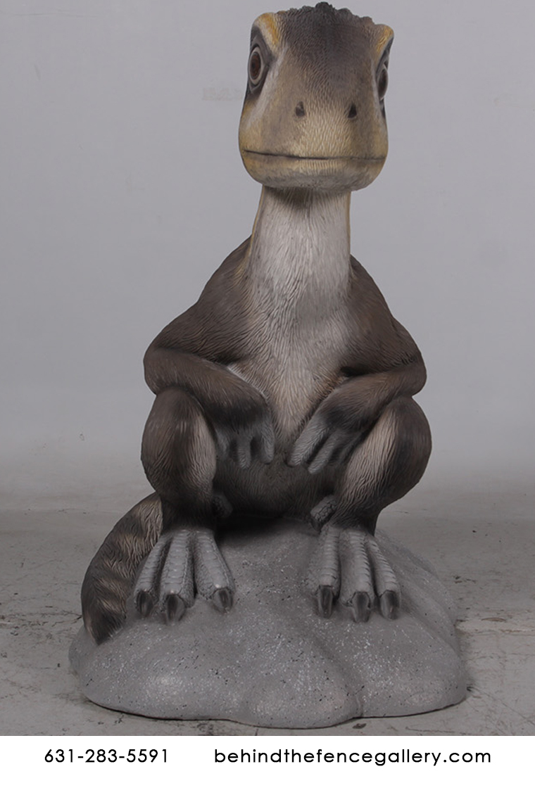 Juvenile Theropod Sitting Dinosaur Statue