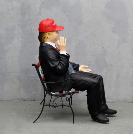 Donald Trump on Bench Wearing MAGA Hat - Click Image to Close